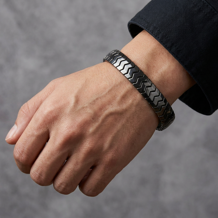 Delemon  featuring a uniform directional stretch bracelet with polished interlocking chevron arrowhead hematite