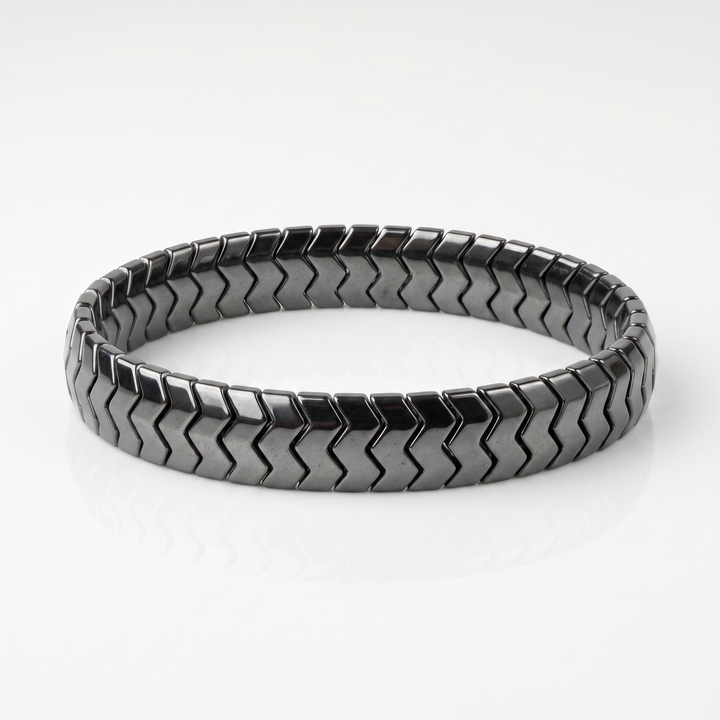 Delemon  featuring a uniform directional stretch bracelet with polished interlocking chevron arrowhead hematite
