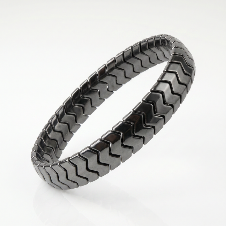 Delemon  featuring a uniform directional stretch bracelet with polished interlocking chevron arrowhead hematite