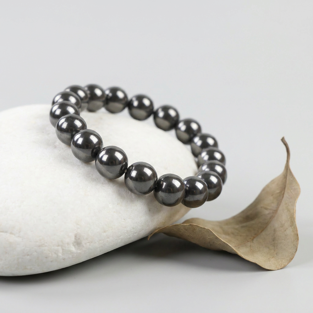 Delemon featuring a uniform round spherical hematite bead stretch bracelet with highly polished gunmetal