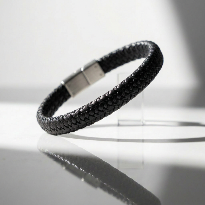 Delemon featuring a single-strand thick braided black genuine leather bracelet with a black steel clasp