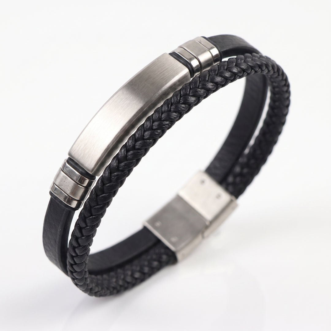   Delemon featuring a dual-strand black leather bracelet with a central brushed stainless steel