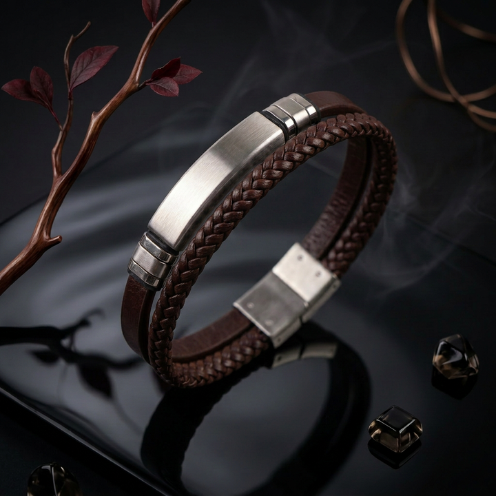 featuring a dual-strand brown leather bracelet with a central brushed stainless steel