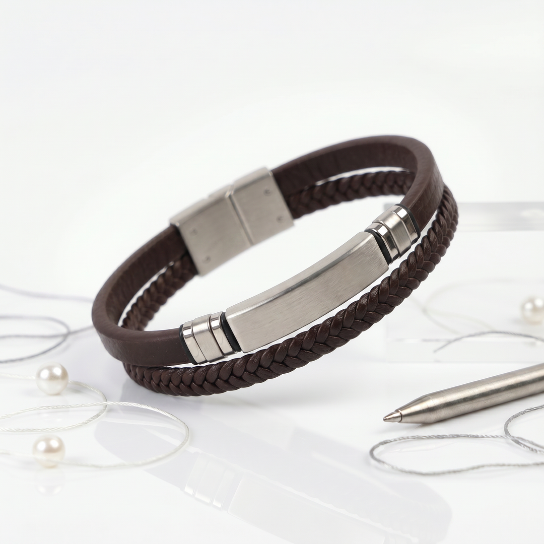 featuring a dual-strand brown leather bracelet with a central brushed stainless steel