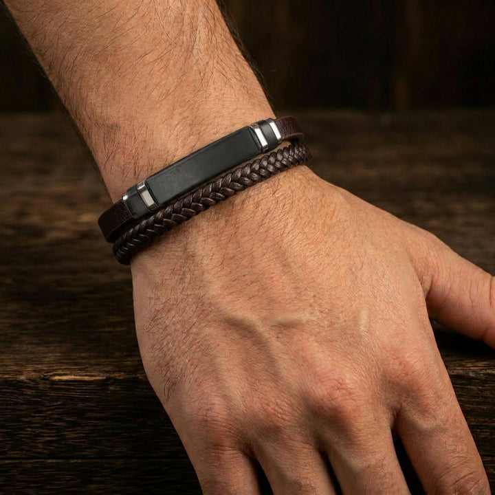 Delemon featuring a dual-strand brown leather bracelet with a central matte black stainless steel