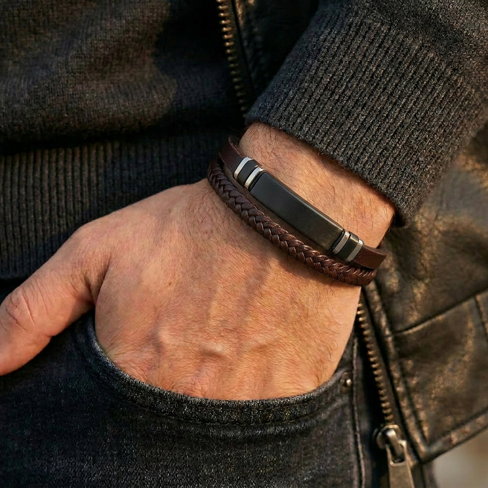 Delemon featuring a dual-strand brown leather bracelet with a central matte black stainless steel