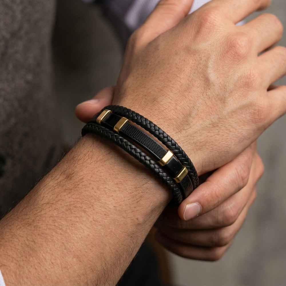 featuring a pre-stacked multi-strand black braided leather bracelet with black and gold