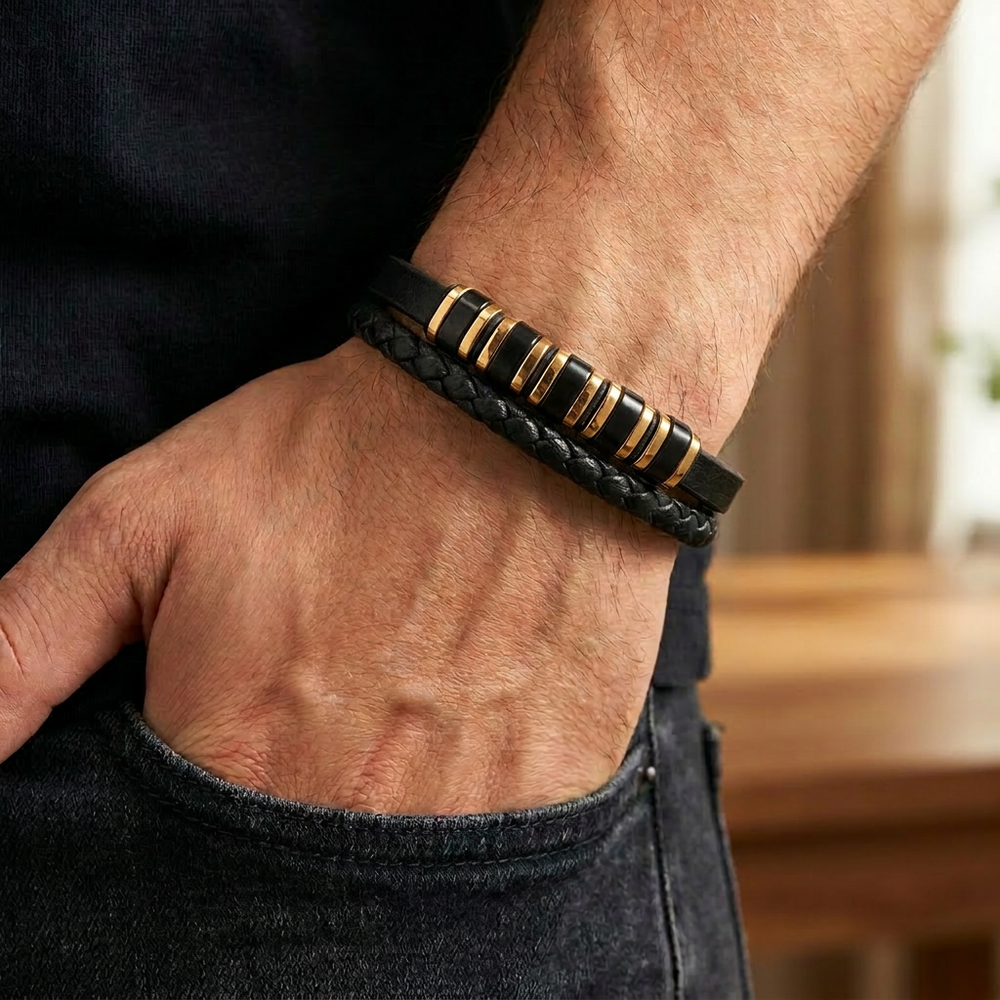 Delemon featuring a dual-strand black leather bracelet with alternating gold and black metal ring