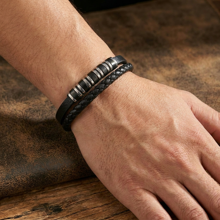 Delemon featuring a dual-strand black leather bracelet with alternating silver and black metal ring