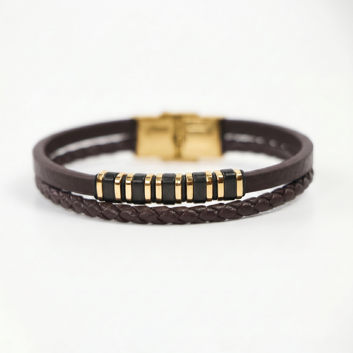 featuring a dual-strand brown leather bracelet with alternating gold and black metal ring