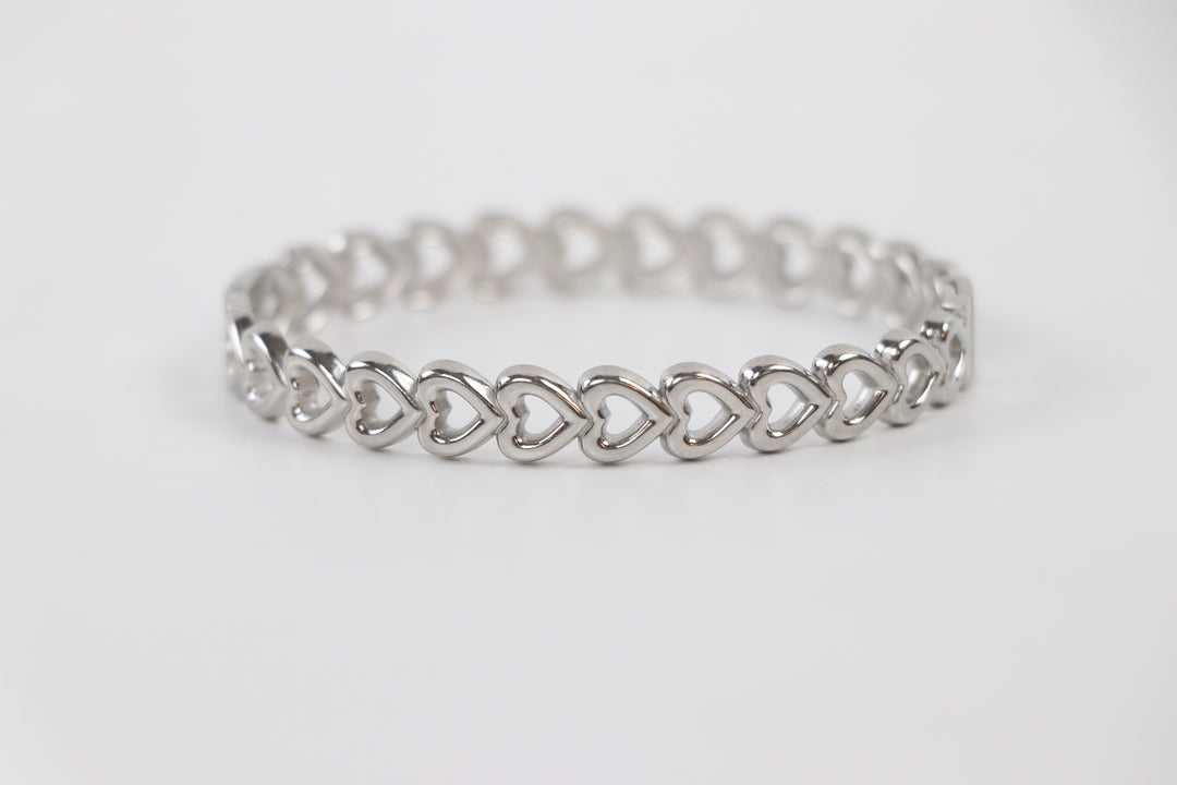 Delemon silver Amara open heart rigid bangle bracelet with continuous interlocking heart shape charms in waterproof 316L stainless steel
