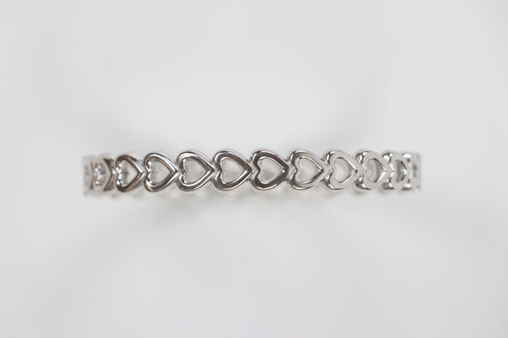Delemon silver Amara open heart rigid bangle bracelet with continuous interlocking heart shape charms in waterproof 316L stainless steel