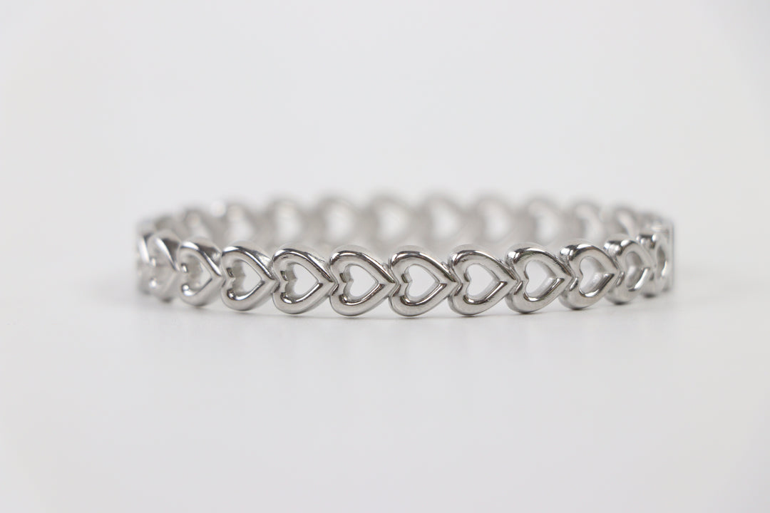Delemon silver Amara open heart rigid bangle bracelet with continuous interlocking heart shape charms in waterproof 316L stainless steel