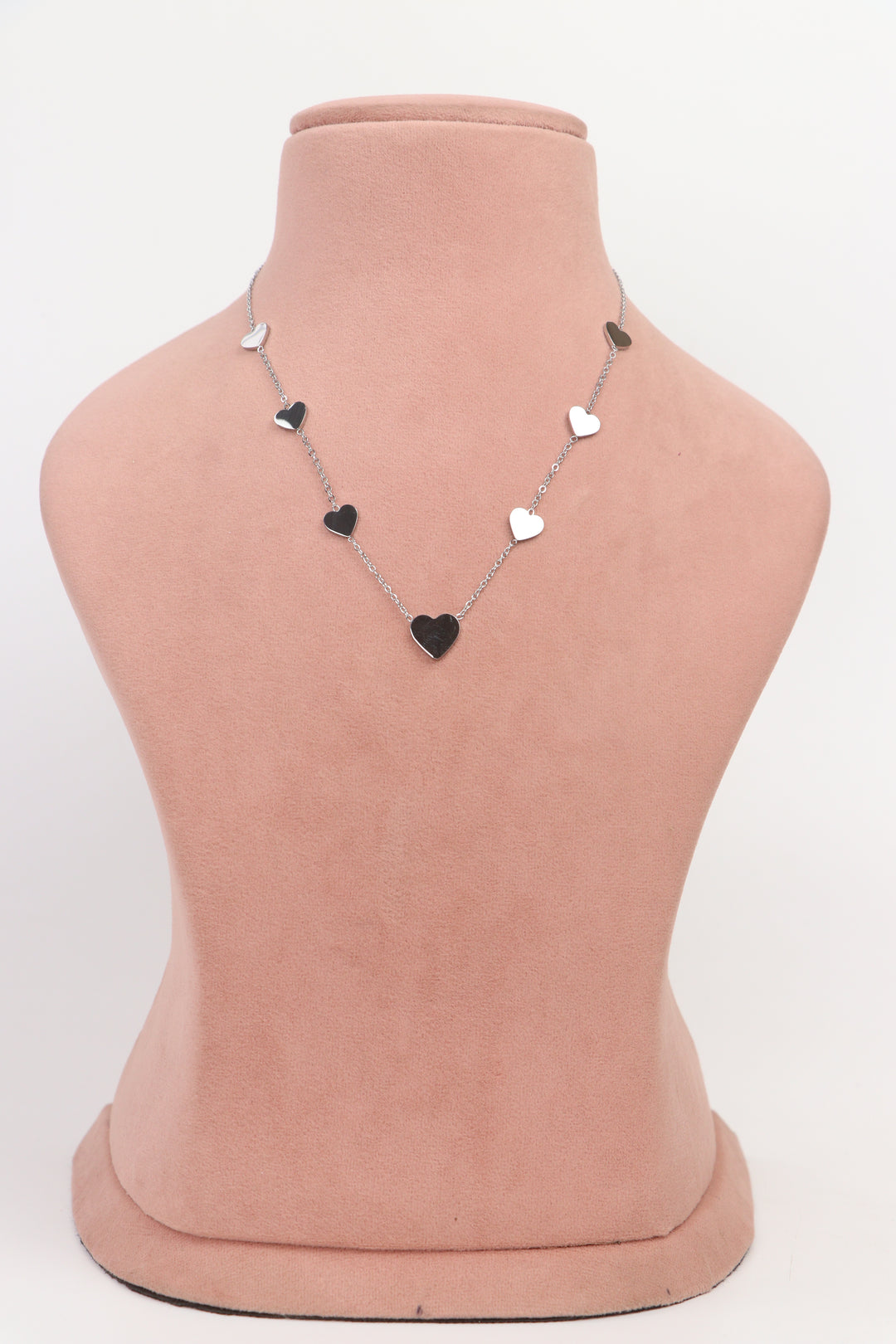 Delemon high-quality silver polished chain necklace featuring multiple delicate heart charms in a station design full front view.