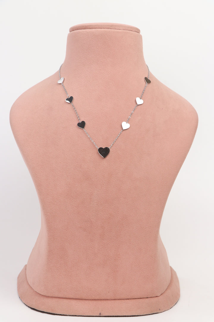 Delemon high-quality silver polished chain necklace featuring multiple delicate heart charms in a station design full front view.