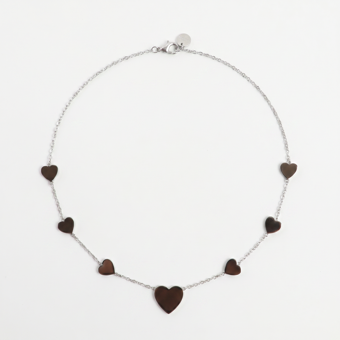 Delemon high-quality silver polished chain necklace featuring multiple delicate heart charms in a station design