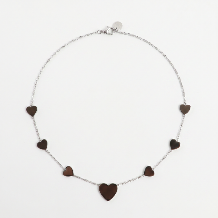 Delemon high-quality silver polished chain necklace featuring multiple delicate heart charms in a station design