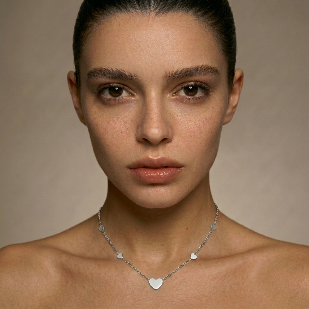 Delemon high-quality silver polished chain necklace featuring multiple delicate heart charms in a station design