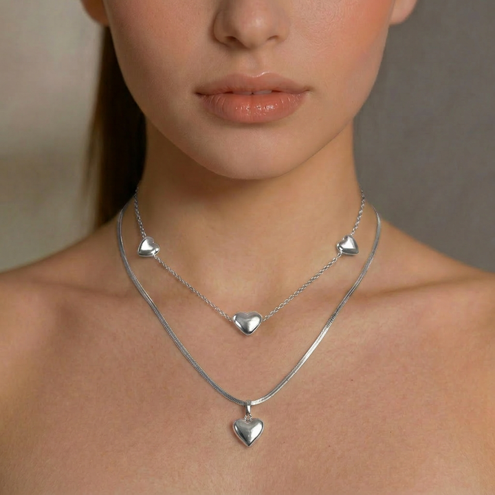 Delemon high-quality silver polished chain necklace featuring multiple delicate heart charms
