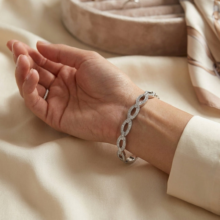 Delemon silver infinity loop open-work crystal bangle bracelet in waterproof 316L stainless steel