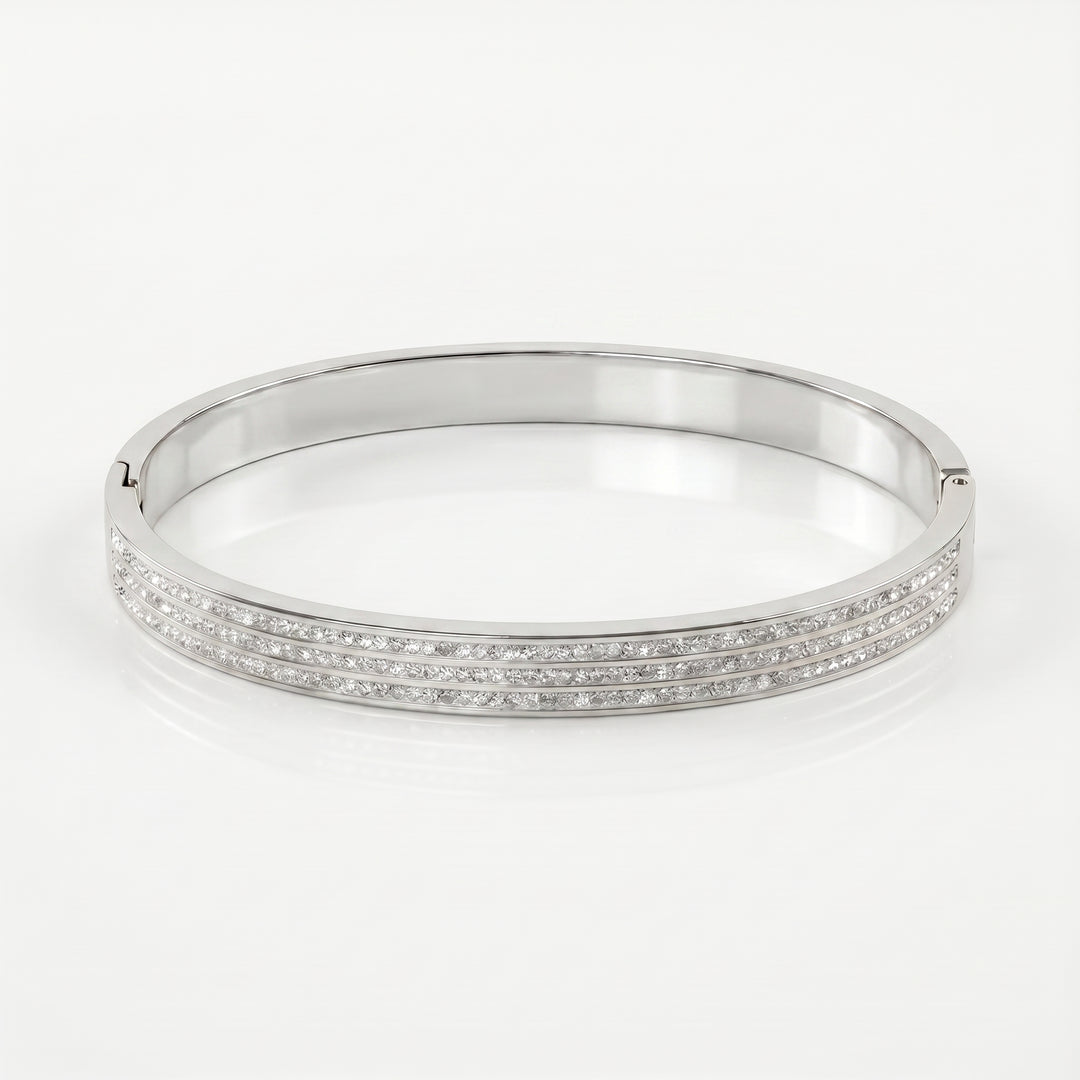 Delemon silver rigid bangle bracelet featuring three rows of clear pavé crystals in waterproof 316L stainless steel