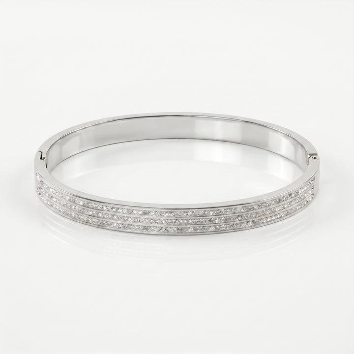 Delemon silver rigid bangle bracelet featuring three rows of clear pavé crystals in waterproof 316L stainless steel