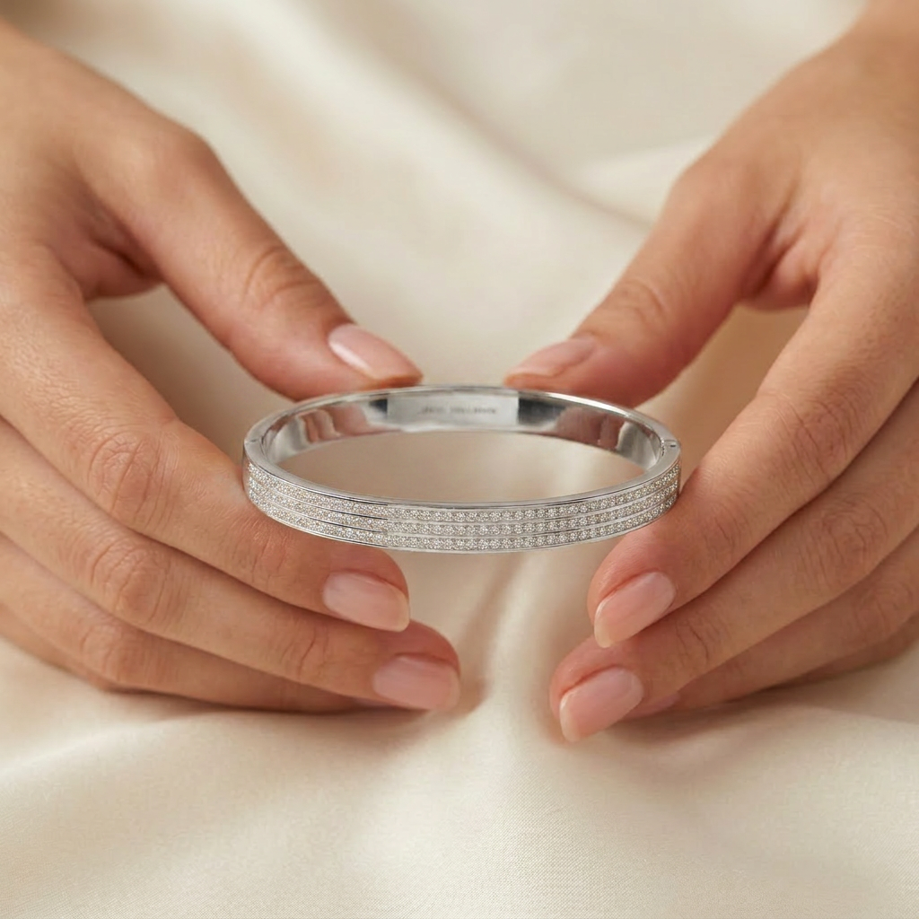 Delemon silver rigid bangle bracelet featuring three rows of clear pavé crystals in waterproof 316L stainless steel