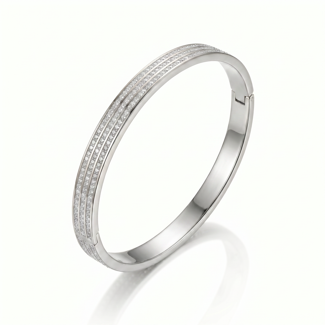 Delemon silver rigid bangle bracelet featuring three rows of clear pavé crystals in waterproof 316L stainless steel