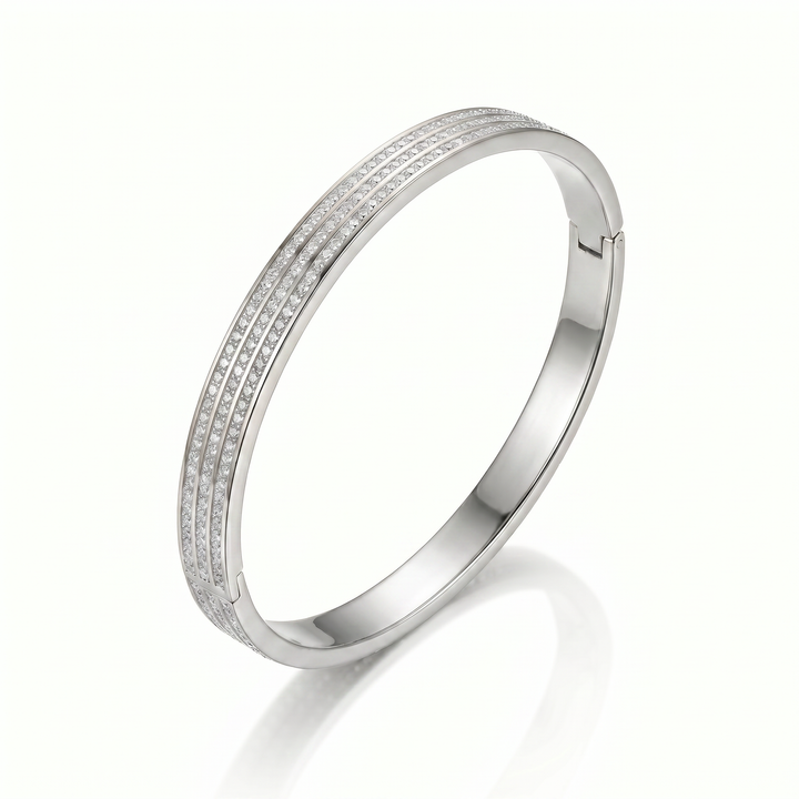 Delemon silver rigid bangle bracelet featuring three rows of clear pavé crystals in waterproof 316L stainless steel
