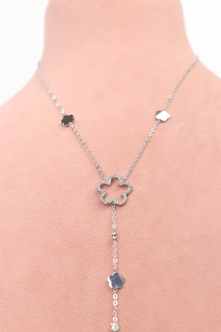 Delemon high-quality silver polished Y-shaped lariat chain necklace with an openwork crystal flower center and hanging floral charms close-up view.