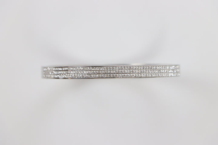 Delemon silver rigid bangle bracelet featuring three rows of clear pavé crystals in waterproof 316L stainless steel