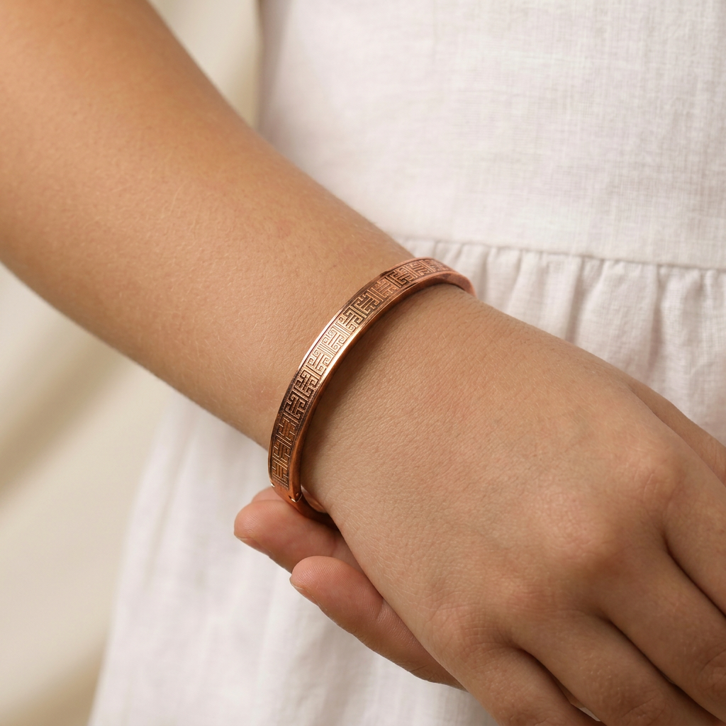 Delemon three-piece rigid bangle stack featuring yellow gold, rose gold, and silver Greek key engraved geometric bracelets in waterproof 316L stainless steel