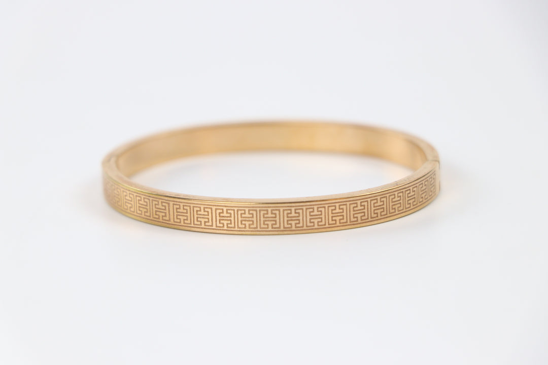 elemon three-piece rigid bangle stack featuring yellow gold, rose gold, and silver Greek key engraved geometric bracelets in waterproof 316L stainless steel