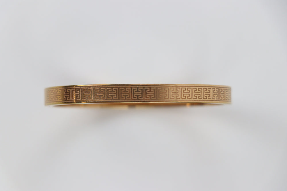 elemon three-piece rigid bangle stack featuring yellow gold, rose gold, and silver Greek key engraved geometric bracelets in waterproof 316L stainless steel