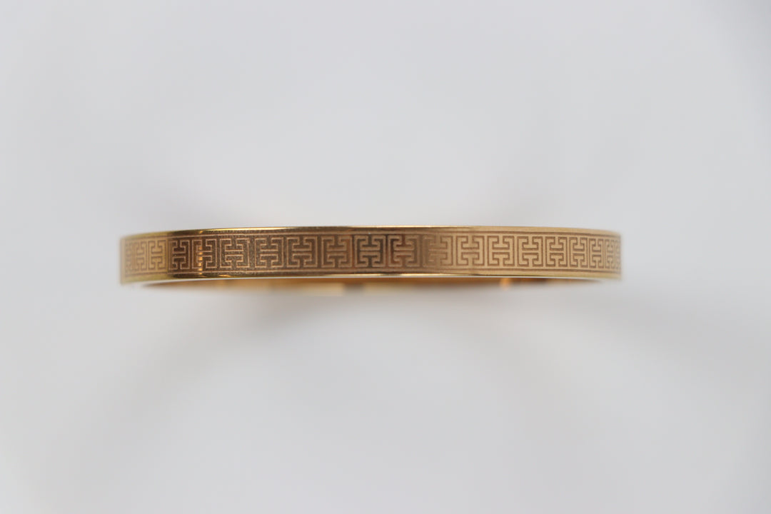 elemon three-piece rigid bangle stack featuring yellow gold, rose gold, and silver Greek key engraved geometric bracelets in waterproof 316L stainless steel