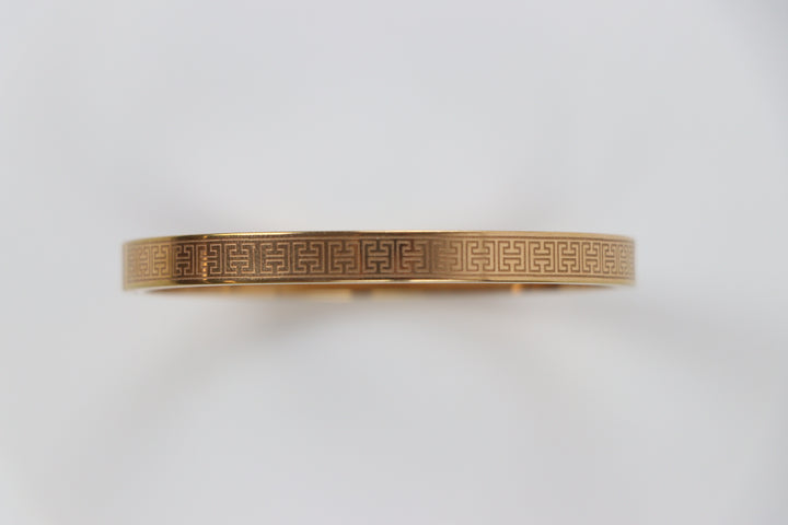 elemon three-piece rigid bangle stack featuring yellow gold, rose gold, and silver Greek key engraved geometric bracelets in waterproof 316L stainless steel
