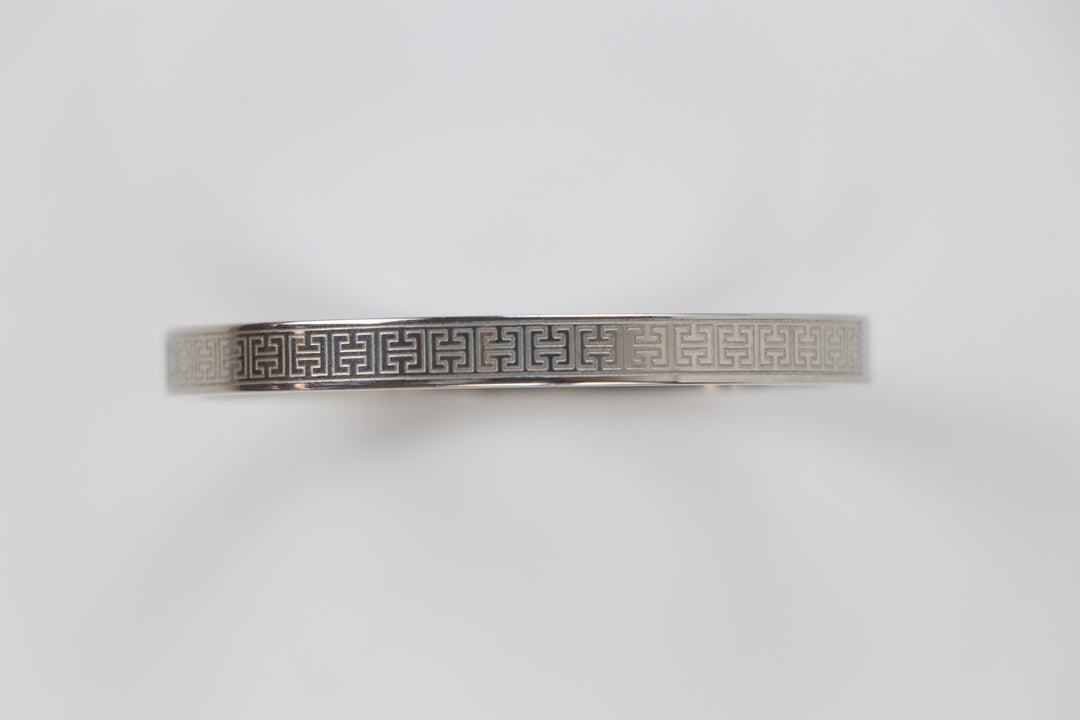 elemon three-piece rigid bangle stack featuring yellow gold, rose gold, and silver Greek key engraved geometric bracelets in waterproof 316L stainless steel