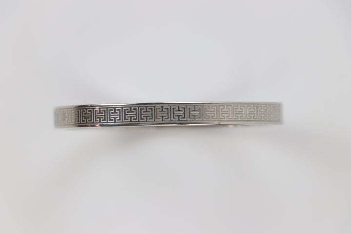 elemon three-piece rigid bangle stack featuring yellow gold, rose gold, and silver Greek key engraved geometric bracelets in waterproof 316L stainless steel