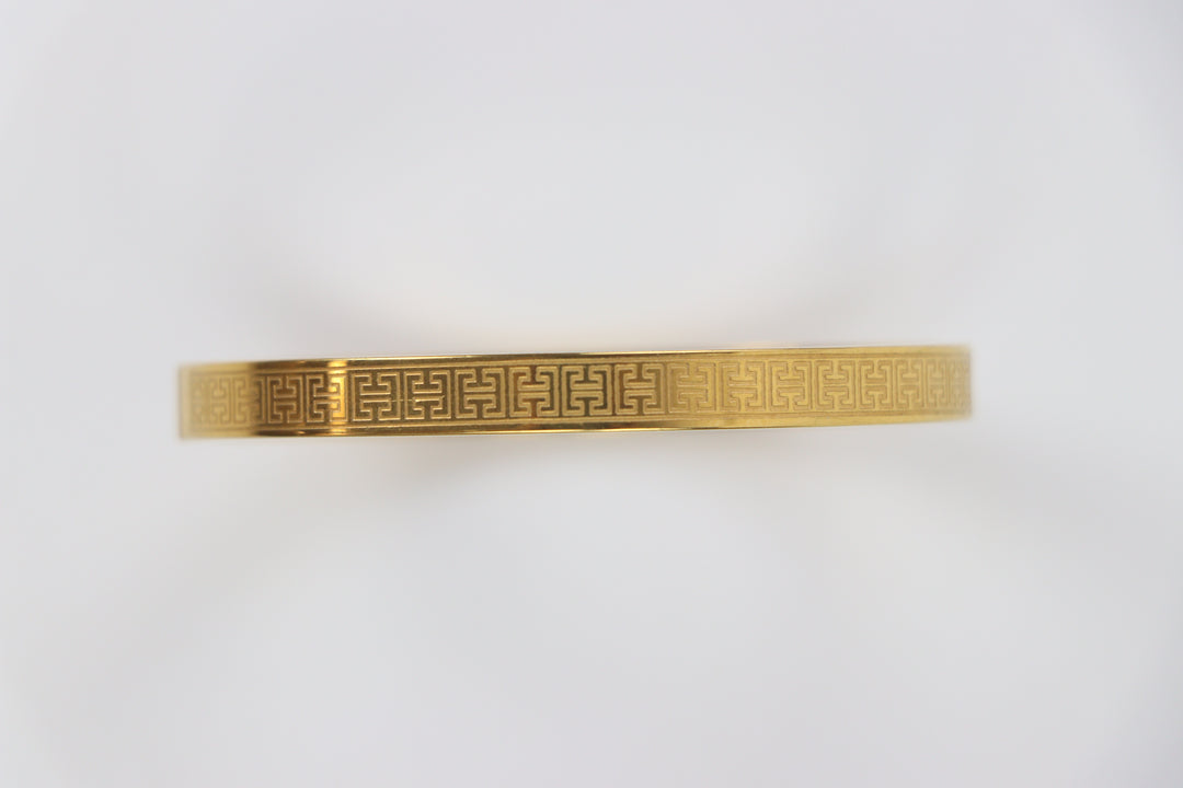elemon three-piece rigid bangle stack featuring yellow gold, rose gold, and silver Greek key engraved geometric bracelets in waterproof 316L stainless steel
