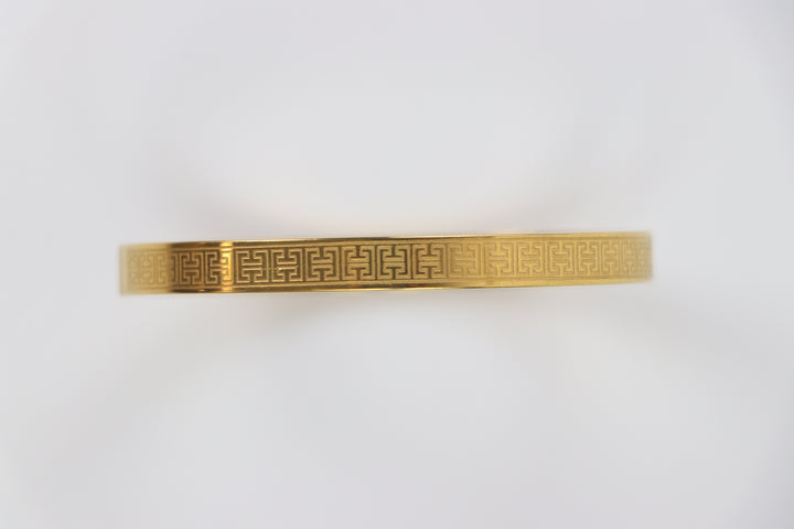 elemon three-piece rigid bangle stack featuring yellow gold, rose gold, and silver Greek key engraved geometric bracelets in waterproof 316L stainless steel