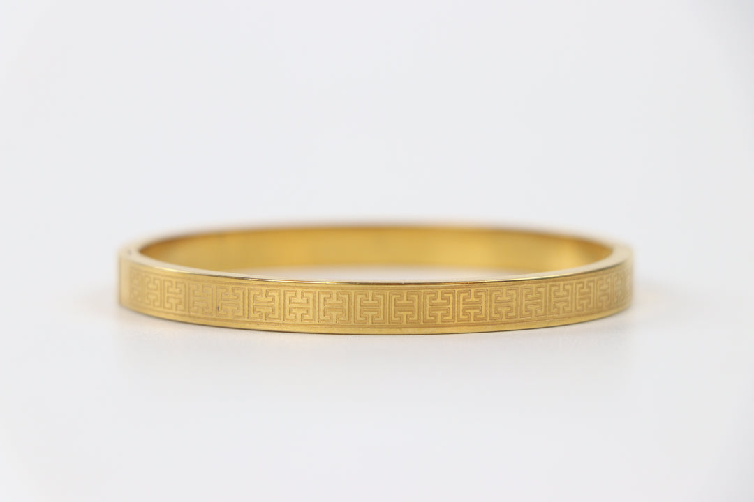 elemon three-piece rigid bangle stack featuring yellow gold, rose gold, and silver Greek key engraved geometric bracelets in waterproof 316L stainless steel