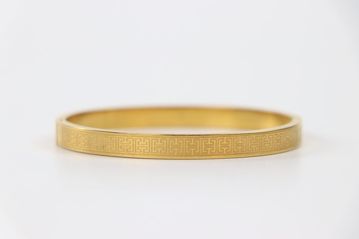 elemon three-piece rigid bangle stack featuring yellow gold, rose gold, and silver Greek key engraved geometric bracelets in waterproof 316L stainless steel