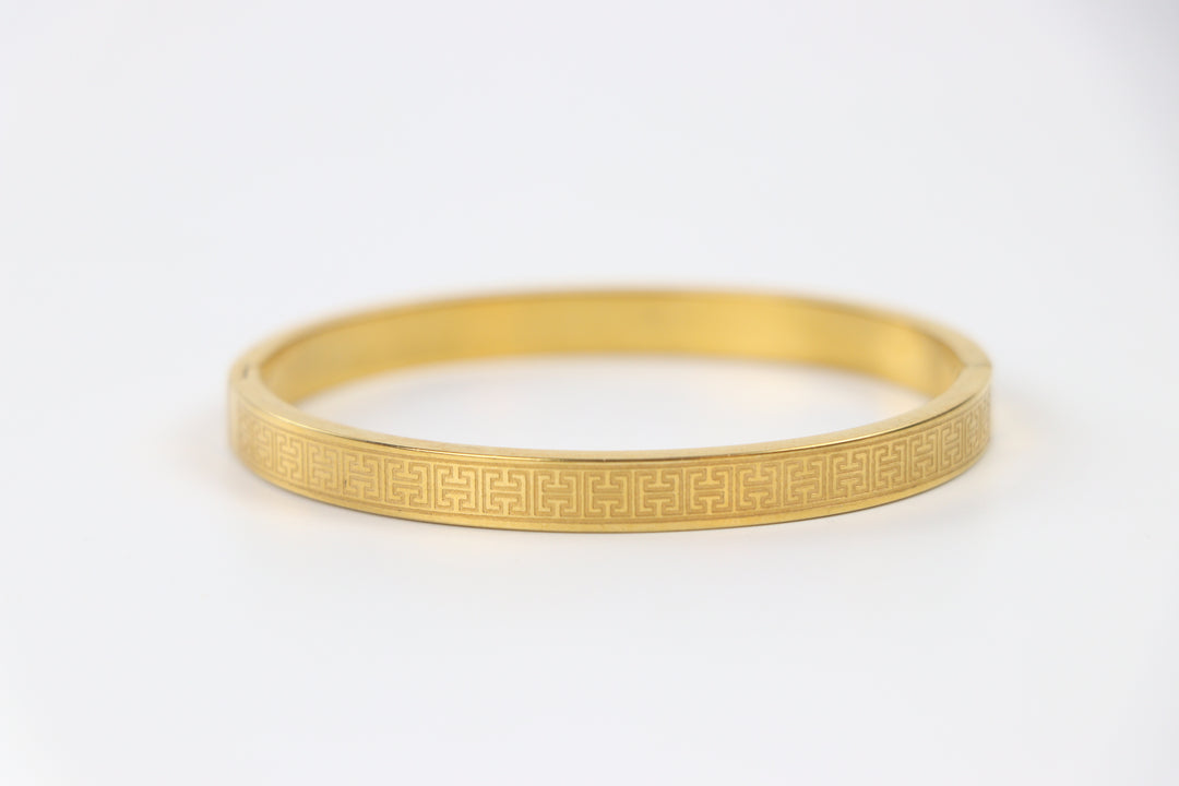 elemon three-piece rigid bangle stack featuring yellow gold, rose gold, and silver Greek key engraved geometric bracelets in waterproof 316L stainless steel