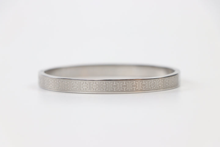 elemon three-piece rigid bangle stack featuring yellow gold, rose gold, and silver Greek key engraved geometric bracelets in waterproof 316L stainless steel