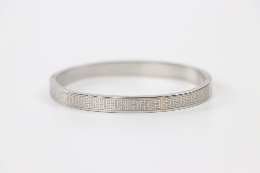 elemon three-piece rigid bangle stack featuring yellow gold, rose gold, and silver Greek key engraved geometric bracelets in waterproof 316L stainless steel