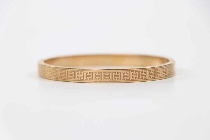 elemon three-piece rigid bangle stack featuring yellow gold, rose gold, and silver Greek key engraved geometric bracelets in waterproof 316L stainless steel
