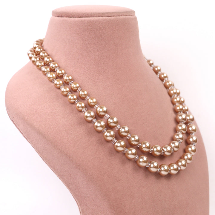 Delemon elegant double-layer golden champagne faux pearl bead necklace displayed at a side angle view.