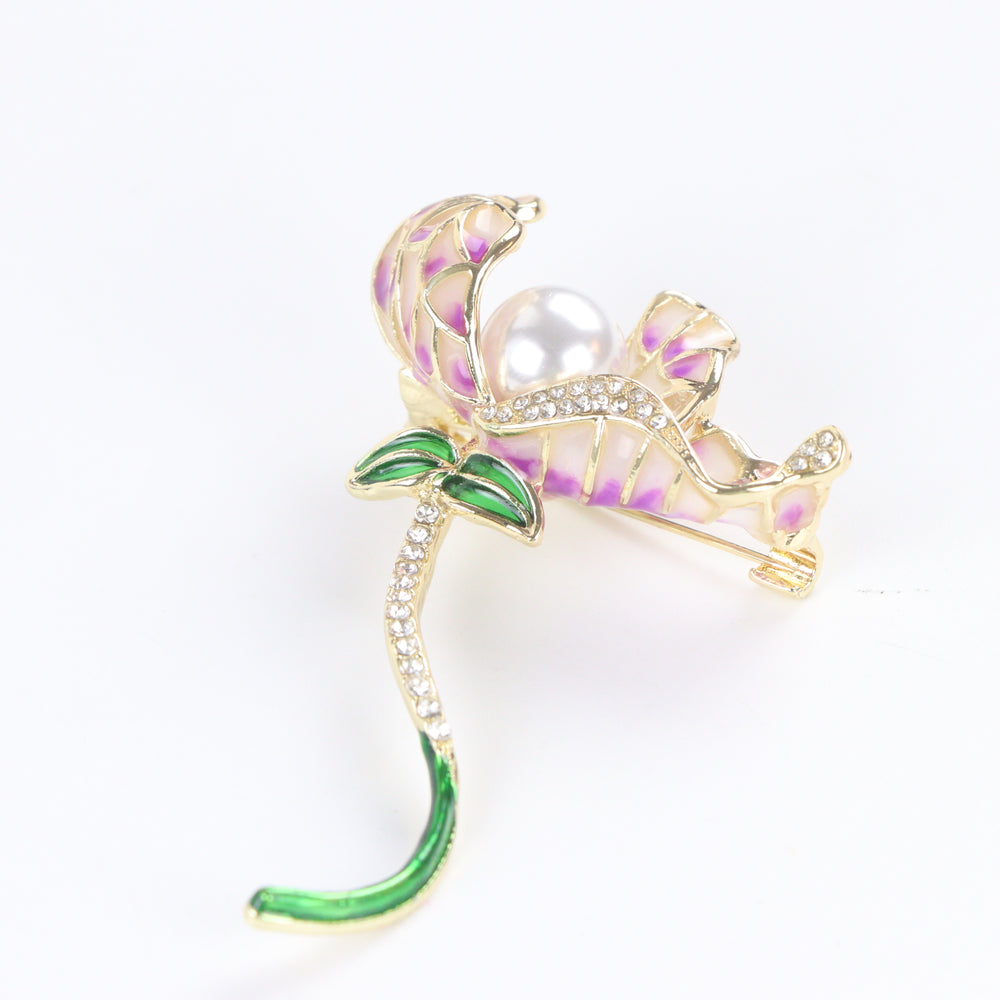 Gold-tone orchid brooch pin featuring purple gradient enamel petals, a large center pearl, and a curved green stem with rhinestones on a white background by Delemon