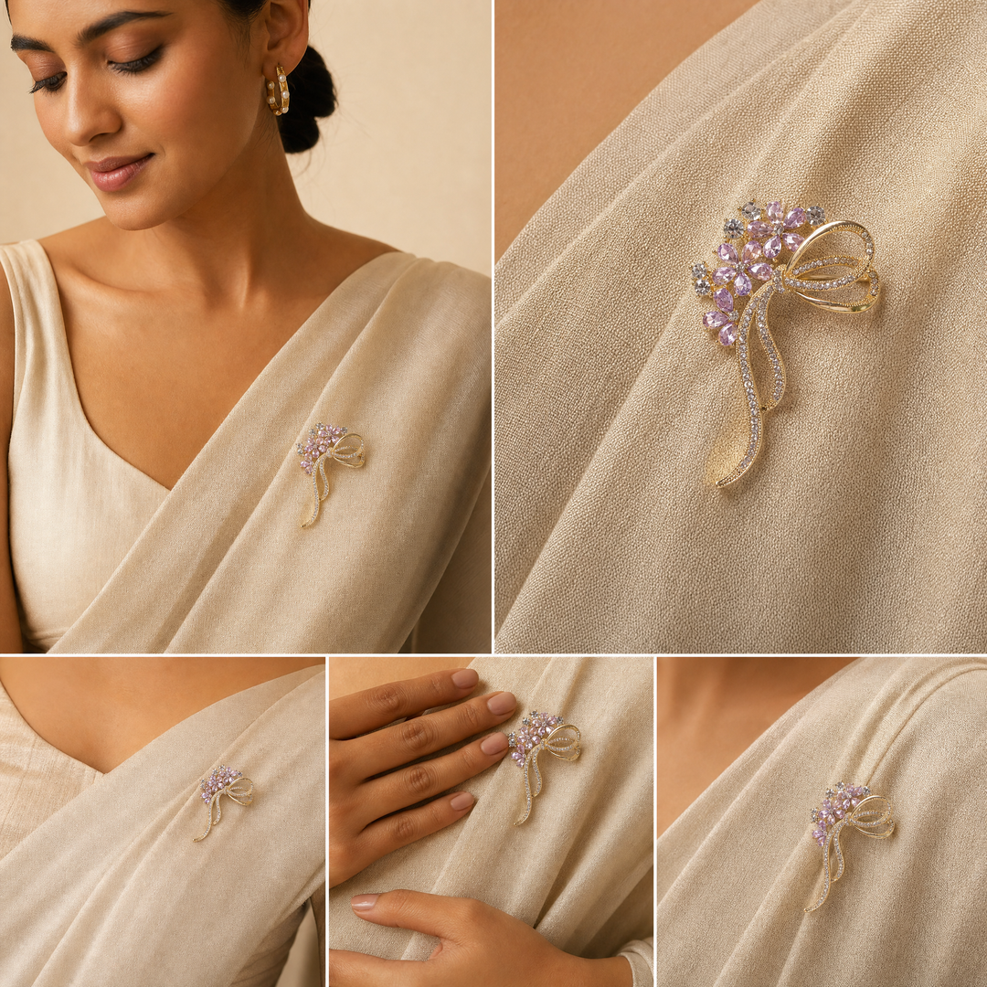 Gold-tone floral bow brooch pin featuring purple tear-drop crystal blossoms and clear pavé rhinestone ribbons 