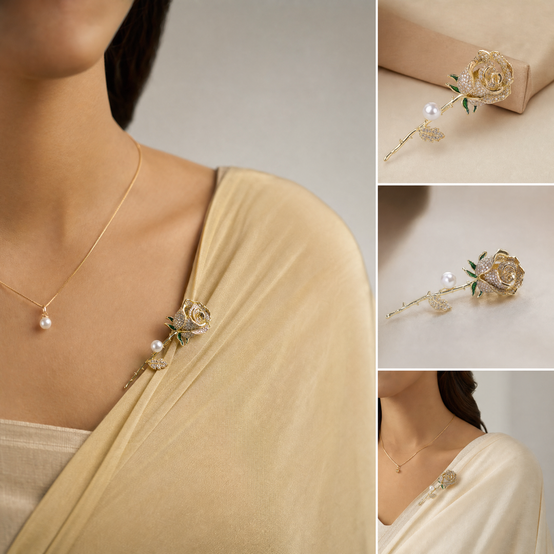 Gold rose brooch pin encrusted with pave crystals, green enamel accents, and a pearl 